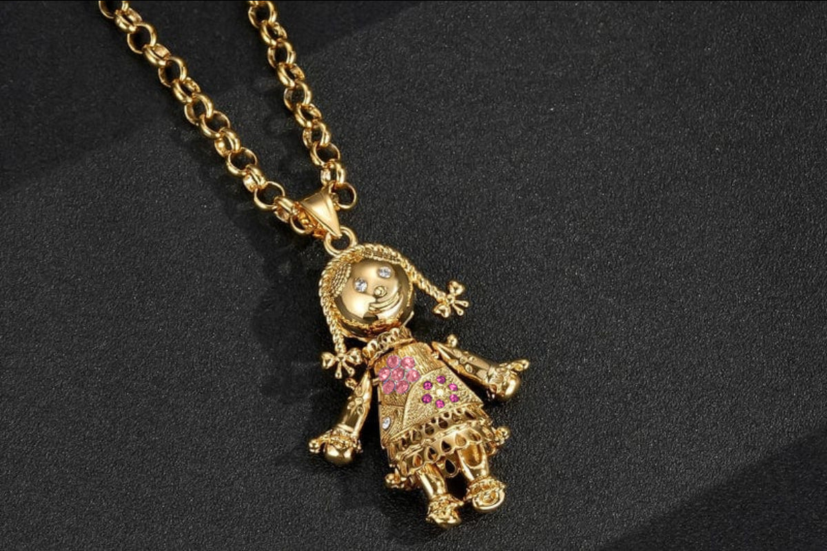 GOLD FILLED RAG DOLL PENDANT WITH RED & PINK STONES